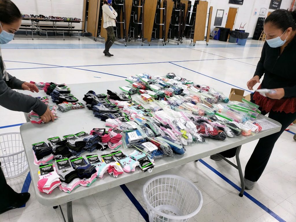 Table of extra clothes provided for the kids with $500 donation